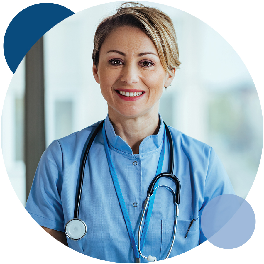 A smiling woman in a blue scrub suit, wearing a stethoscope, representing occupational health services.