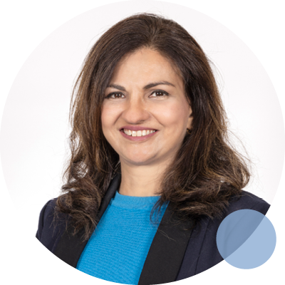 Dr Jasvin Kaur Josen smiling in professional business attire