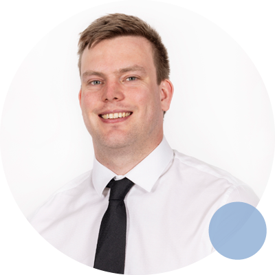 Dr Louis Connell smiling in professional attire